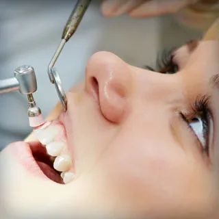 person getting their teeth cleaned